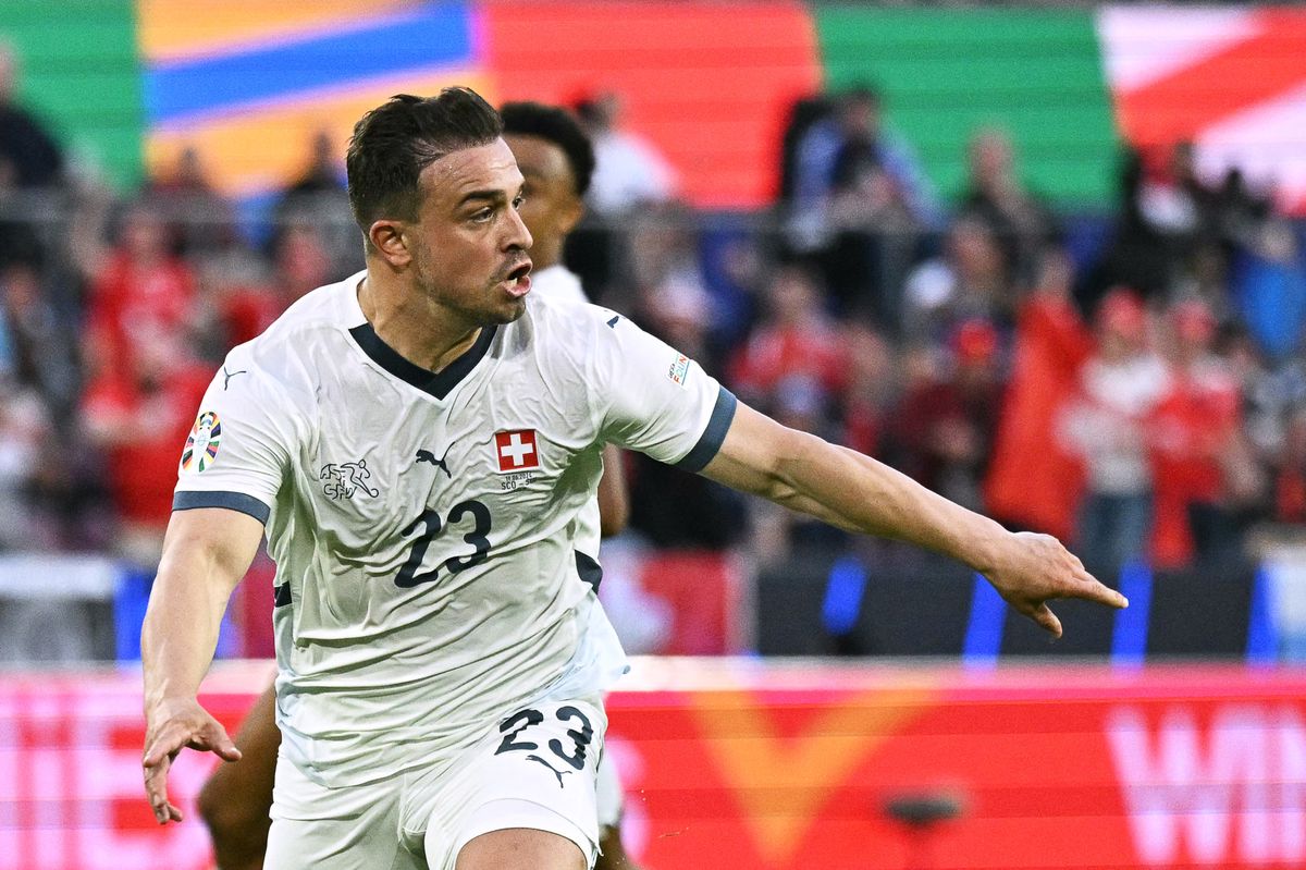 Switzerland's midfielder #23 Xherdan Shaqiri celebrates scoring his team's first goal during the UEFA Euro 2024 Group A football match between Scotland and Switzerland at the Cologne Stadium in Cologne on June 19, 2024. (Photo by JAVIER SORIANO / AFP)