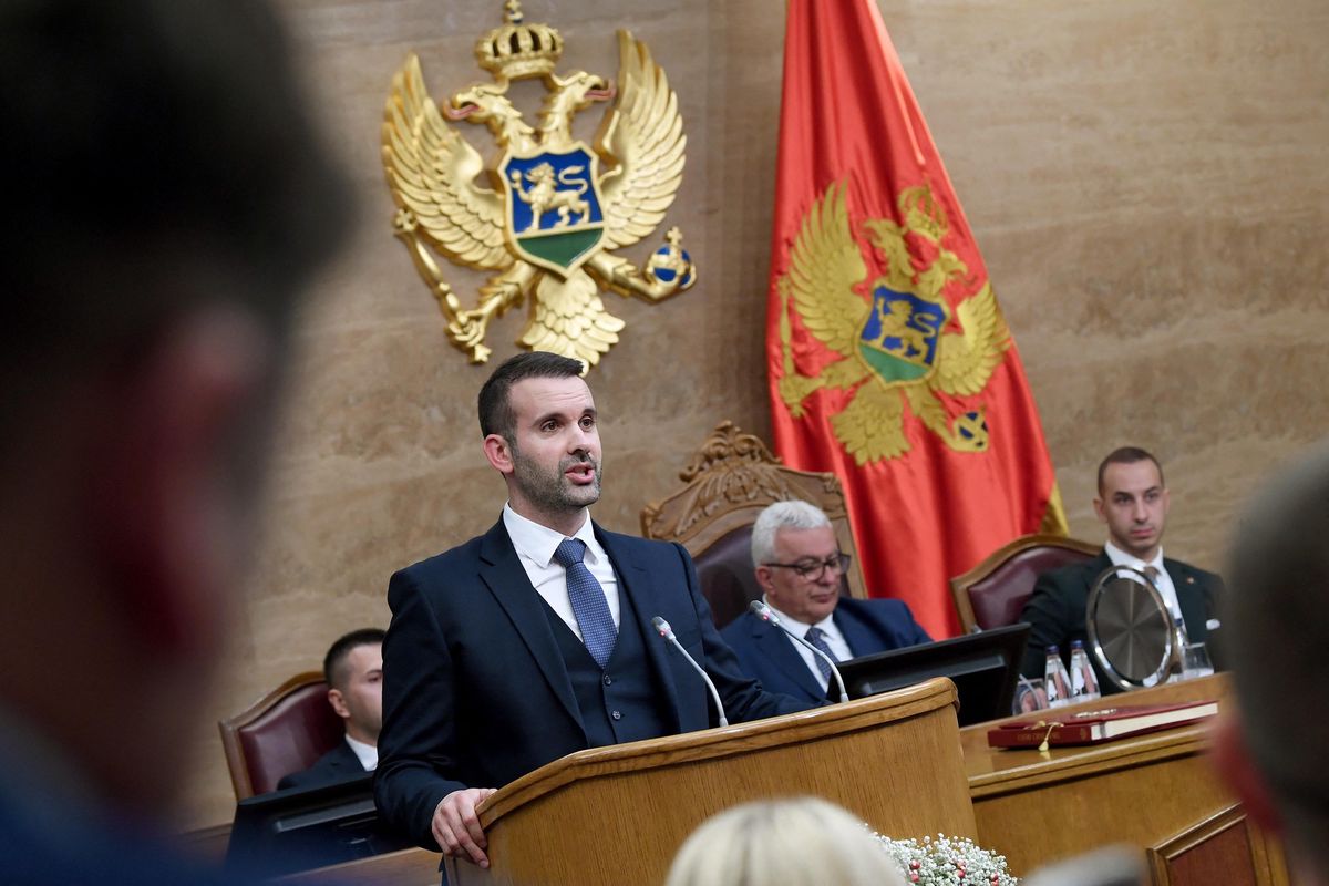 Montenegro's newly elected Prime Minister Milojko Spajic addresses the parliament in Podgorica early hours on October 31, 2023. Montenegrin lawmakers on Tuesday voted in a new government, backed by a pro-Russian alliance, nearly five months after general elections. Prime Minister Milojko Spajic's government was voted in after a marathon overnight debate, supported by 46 of 66 the MPs present in the 81-member parliament. (Photo by SAVO PRELEVIC / AFP)
