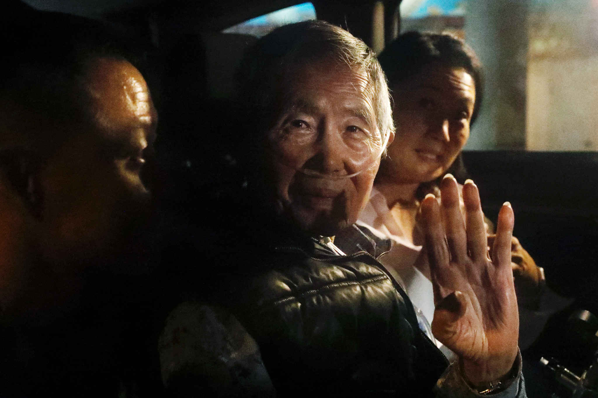LIMA, PERU - DECEMBER 06: Former president of Peru Alberto Fujimori exits in a car the Barbadillo prison after being released on December 06, 2023 in Lima, Peru. On Tuesday, Peru's Constitutional Tribunal ordered the immediate release of former president Alberto Fujimori who is serving a 25 years sentence in connection with the death squad slayings of 25 Peruvians in the 1990s. This pardon request was appealed by the Inter-American Commission on Human Rights. (Photo by Mariana Bazo/Getty Images)