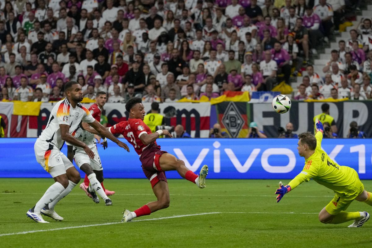Switzerland's Dan Ndoye scores his side's opening goal during a Group A match between Switzerland and Germany at the Euro 2024 soccer tournament in Frankfurt, Germany, Sunday, June 23, 2024. (AP Photo/Frank Augstein)