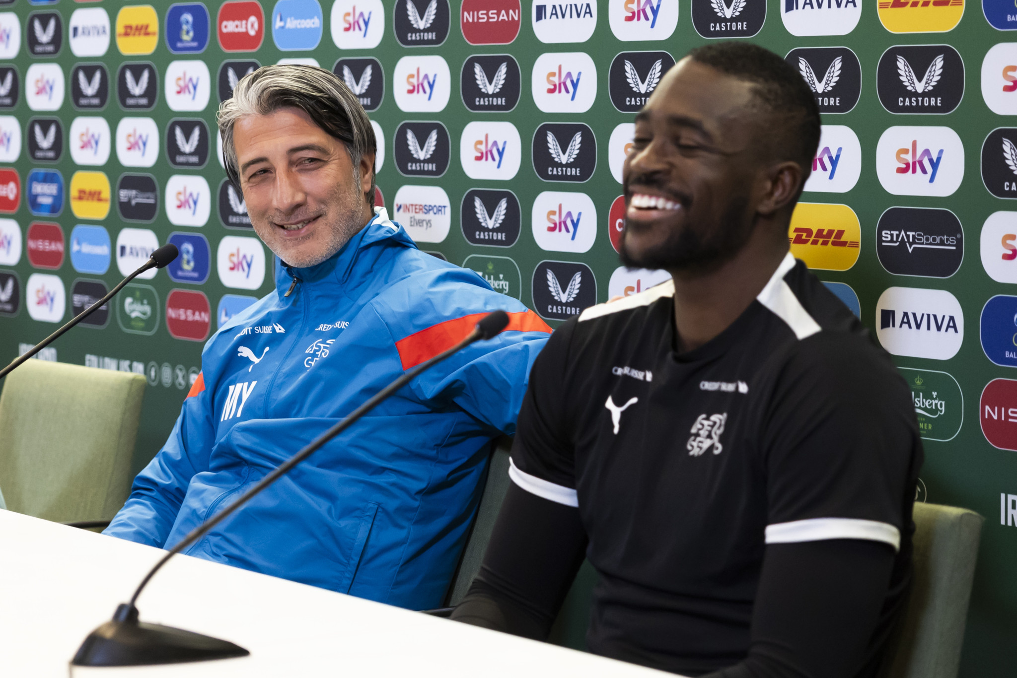 Switzerland's head coach Murat Yakin, left, and his goalkeeper Yvon Mvogo react during a press conference one day ahead of the international friendly soccer match between Ireland and Switzerland at the Aviva Stadium in Dublin, Ireland, Monday, March 25, 2024. (KEYSTONE/Peter Klaunzer)