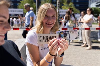 Lucky ones with tickets: Grace from Wisconsin proudly held up her VIP ticket to the camera.