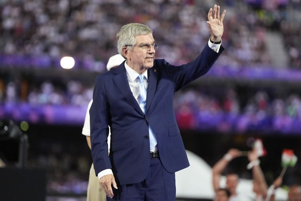 IOC President Thomas Bach waves during the 2024 Summer Olympics closing ceremony at the Stade de France, Sunday, Aug. 11, 2024, in Saint-Denis, France. (AP Photo/Natacha Pisarenko)
