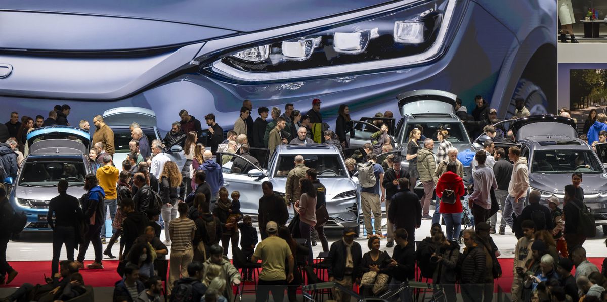 Visitors gather at the BYD booth, during the last day of the 91th Geneva International Motor Show (GIMS) in Geneva, Switzerland, Sunday, March 03, 2024. The Motor Show will open its gates to the public from 27 February to 3 March. (KEYSTONE/Martial Trezzini)