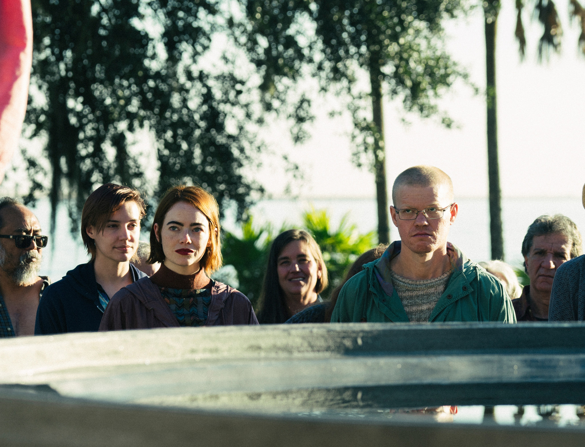 This image released by Searchlight Pictures shows Emma Stone, foreground left, and Jesse Plemons in a scene from "Kinds of Kindness." (Atsushi Nishijima/Searchlight Pictures via AP)