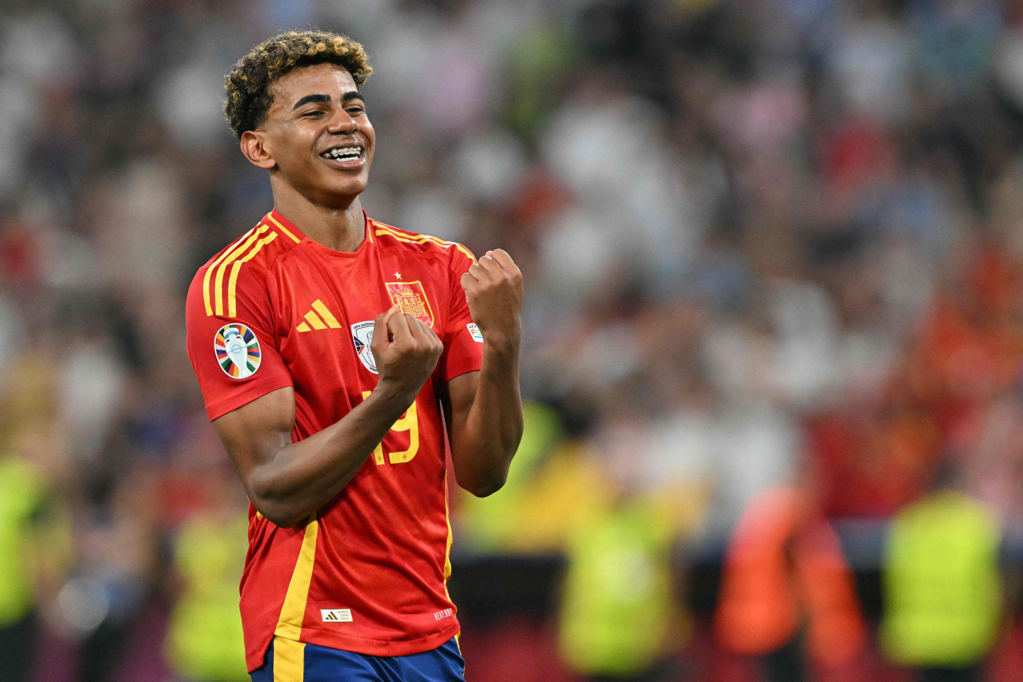 TOPSHOT - Spain's forward #19 Lamine Yamal celebrates at the end of the UEFA Euro 2024 semi-final football match between Spain and France at the Munich Football Arena in Munich on July 9, 2024. (Photo by MIGUEL MEDINA / AFP)
