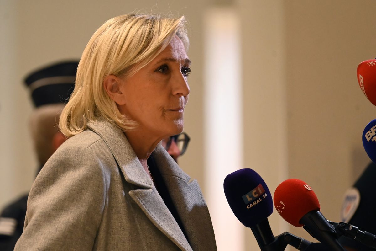 Marine Le Pen, leader of the French far-right party, speaks to the press at the Paris courthouse facing trial for alleged embezzlement and collusion on 30 September 2024.