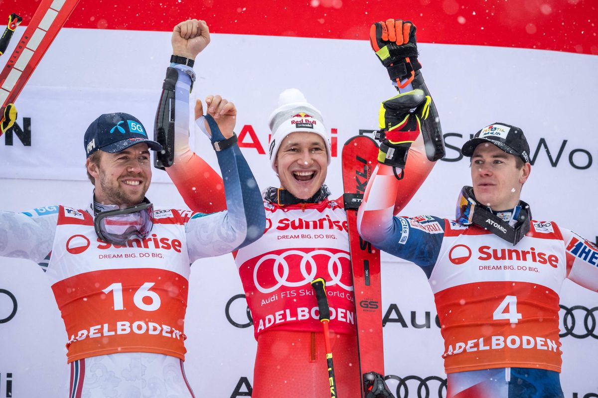 (L-R)second placed Norway’s Aleksander Aamodt Kilde, winner Switzerland’s Marco Odermatt and third placed Croatia’s Filip Zubcic react on the podium during the ceremony of  the Men's Giant Slalom event during the FIS Alpine Ski World Cup event in Adelboden, Switzerland, on January 6, 2024. (Photo by Fabrice COFFRINI / AFP)