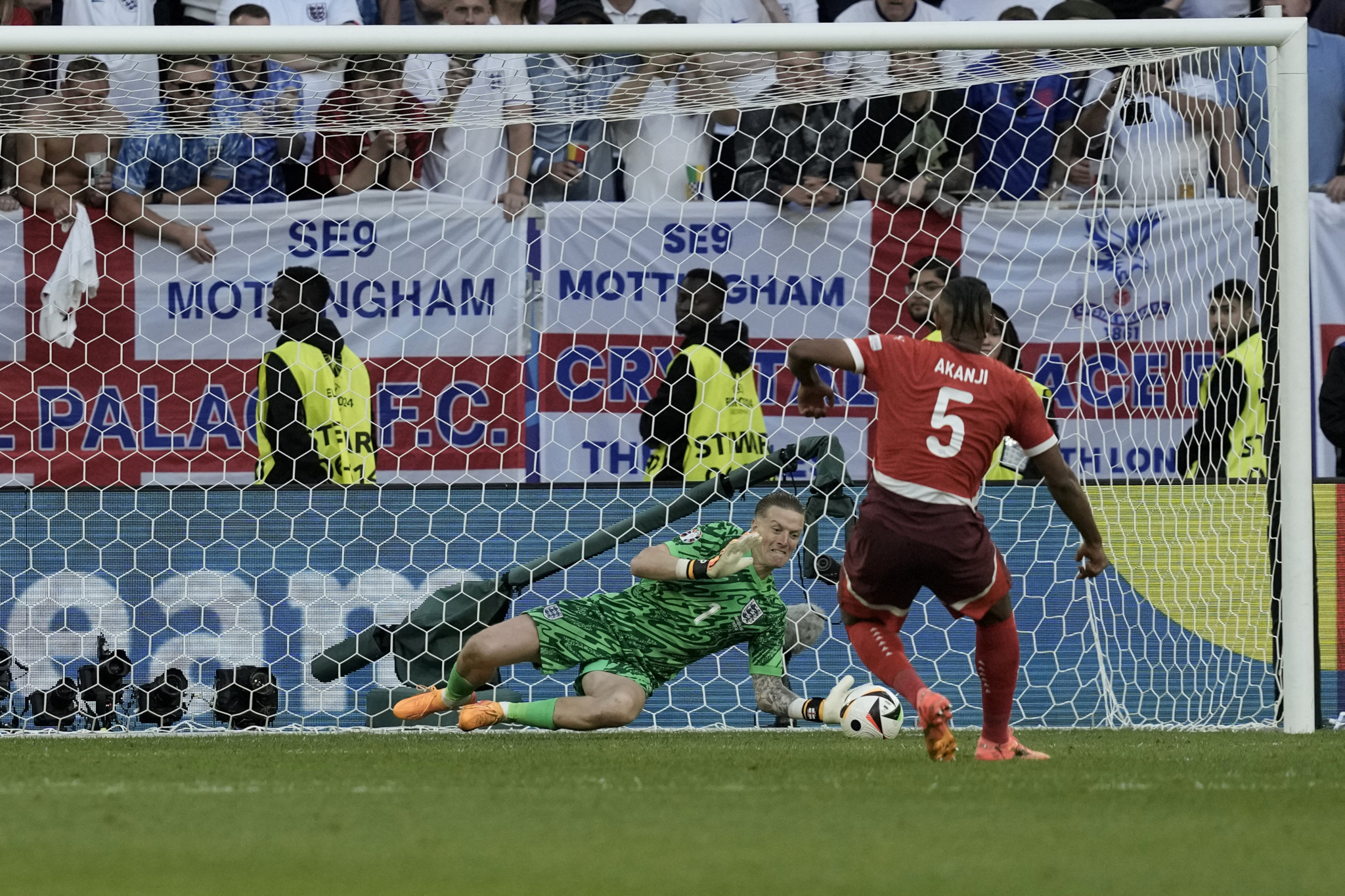 England's goalkeeper Jordan Pickford makes a save during penalty shootout of the quarterfinal match between England and Switzerland at the Euro 2024 soccer tournament in Duesseldorf, Germany, Saturday, July 6, 2024. (AP Photo/Thanassis Stavrakis)