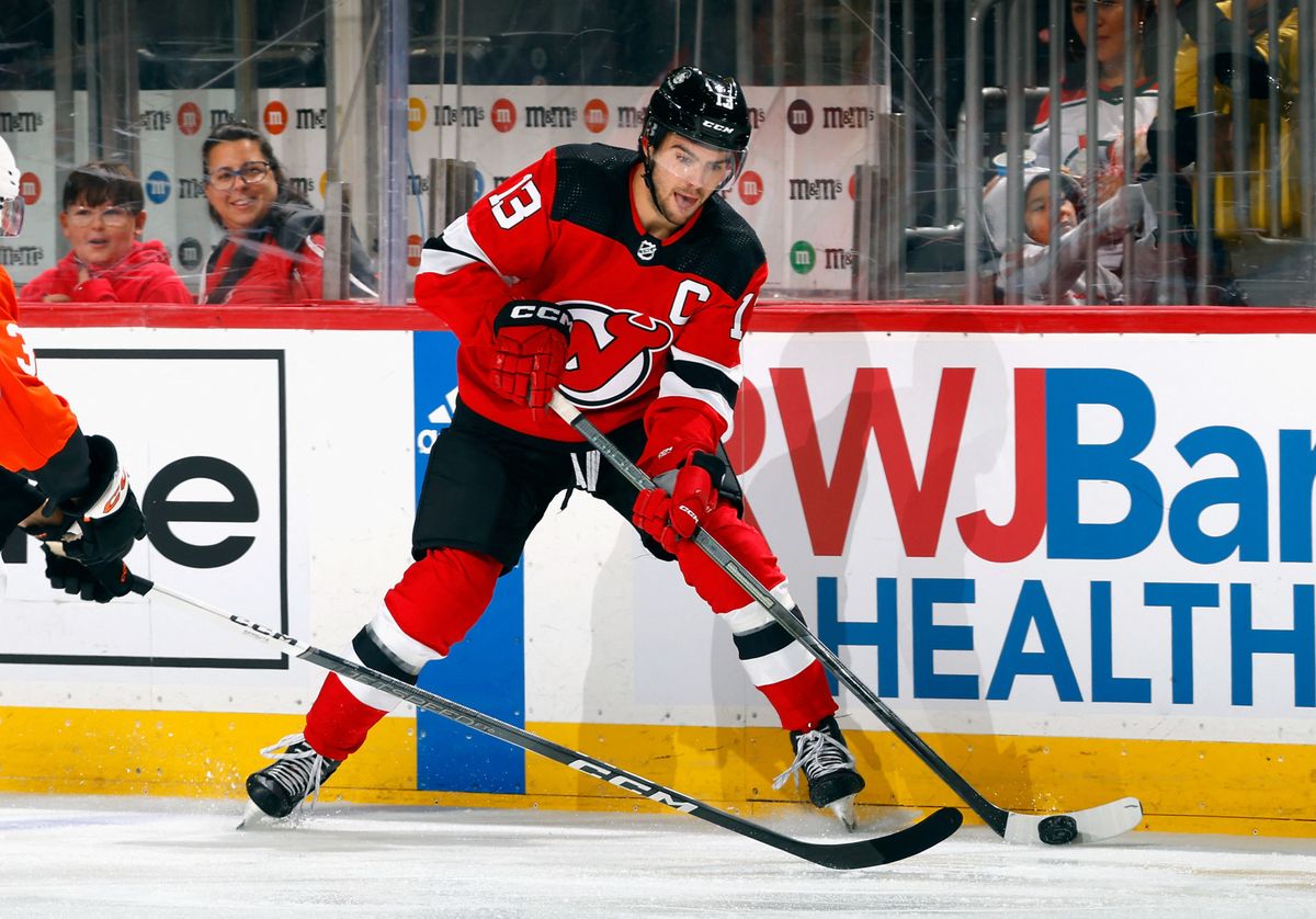 NEWARK, NEW JERSEY - SEPTEMBER 25: Nico Hischier #13 of New Jersey Devils skates against the Philadelphia Flyers at a preseason game at the Prudential Center on September 25, 2023 in Newark, New Jersey.   Bruce Bennett/Getty Images/AFP (Photo by BRUCE BENNETT / GETTY IMAGES NORTH AMERICA / Getty Images via AFP)