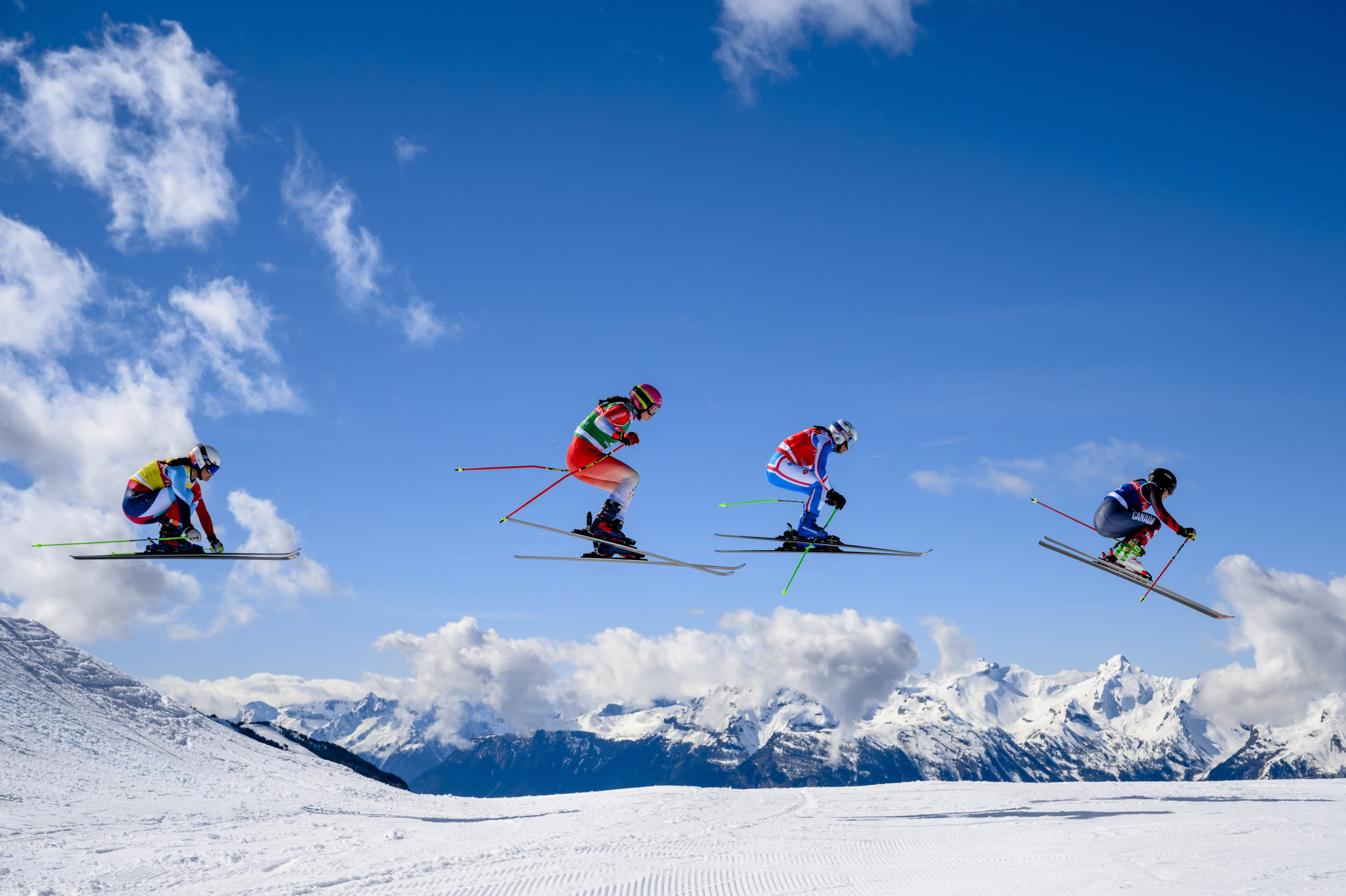 Stephanie Joffroy of Chile, Saskja Lack of Switzerland, Marielle Berger of France and Tiana Gairns of Canada in action during the 1/4 final of the women's Ski Cross event at the FIS Ski Cross, SX, World Cup, in Veysonnaz, Switzerland, Saturday, March 16, 2024. (KEYSTONE/Jean-Christophe Bott)