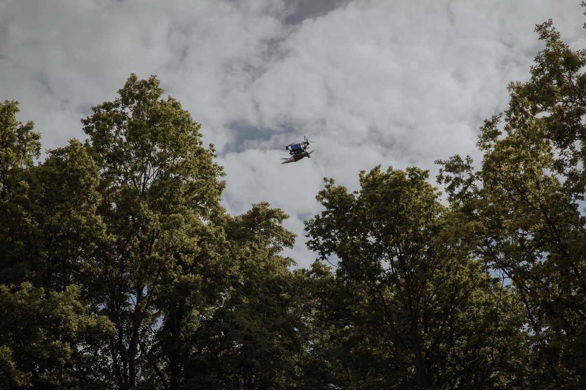 An FPV suicide drone launched by Ukrainian servicemen of the Achilles Battalion of the 92nd Assault Brigade flies towards Russian positions, in the Kharkiv region, on May 16, 2024, amid the Russian invasion of Ukraine. (Photo by Roman PILIPEY / AFP)