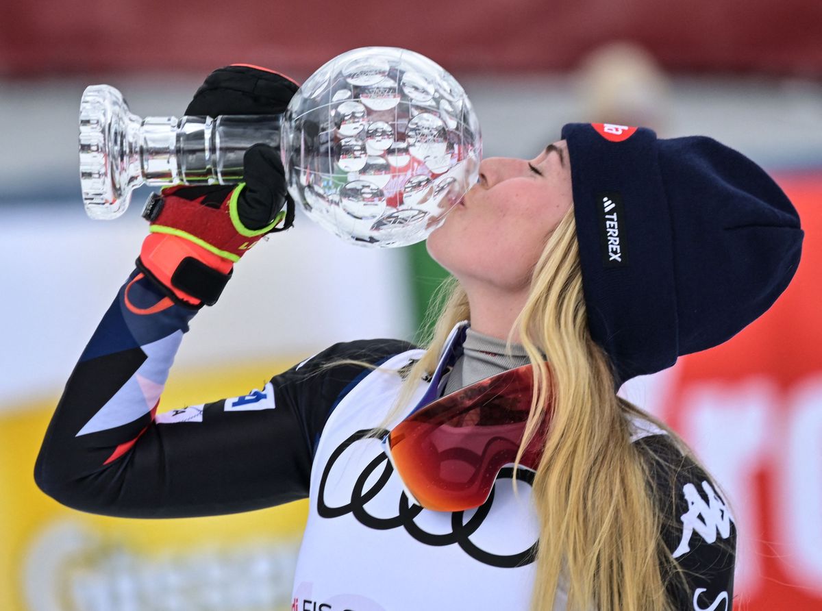 Winner USA's Mikaela Shiffrin kisses the trophy after the women's Slalom event of FIS Ski Alpine World Cup in Saalbach, Austria on March 16, 2024. (Photo by Joe Klamar / AFP)