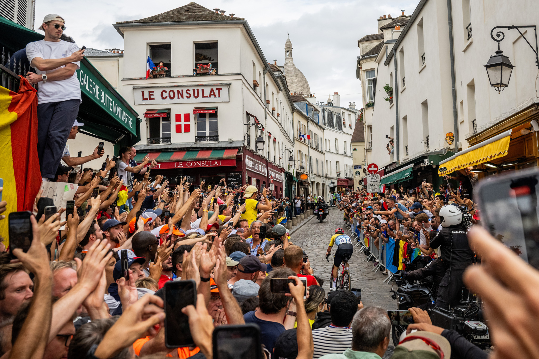 PARIS, FRANCE - AUGUST 03: Remco Evenepoel of Team Belgium attacks in the breakaway passing through the Cote de la butte Montmartre while fans cheers during the Men's Road Race on day eight of the Olympic Games Paris 2024 at trocadero on August 03, 2024 in Paris, France. (Photo by David Ramos/Getty Images)