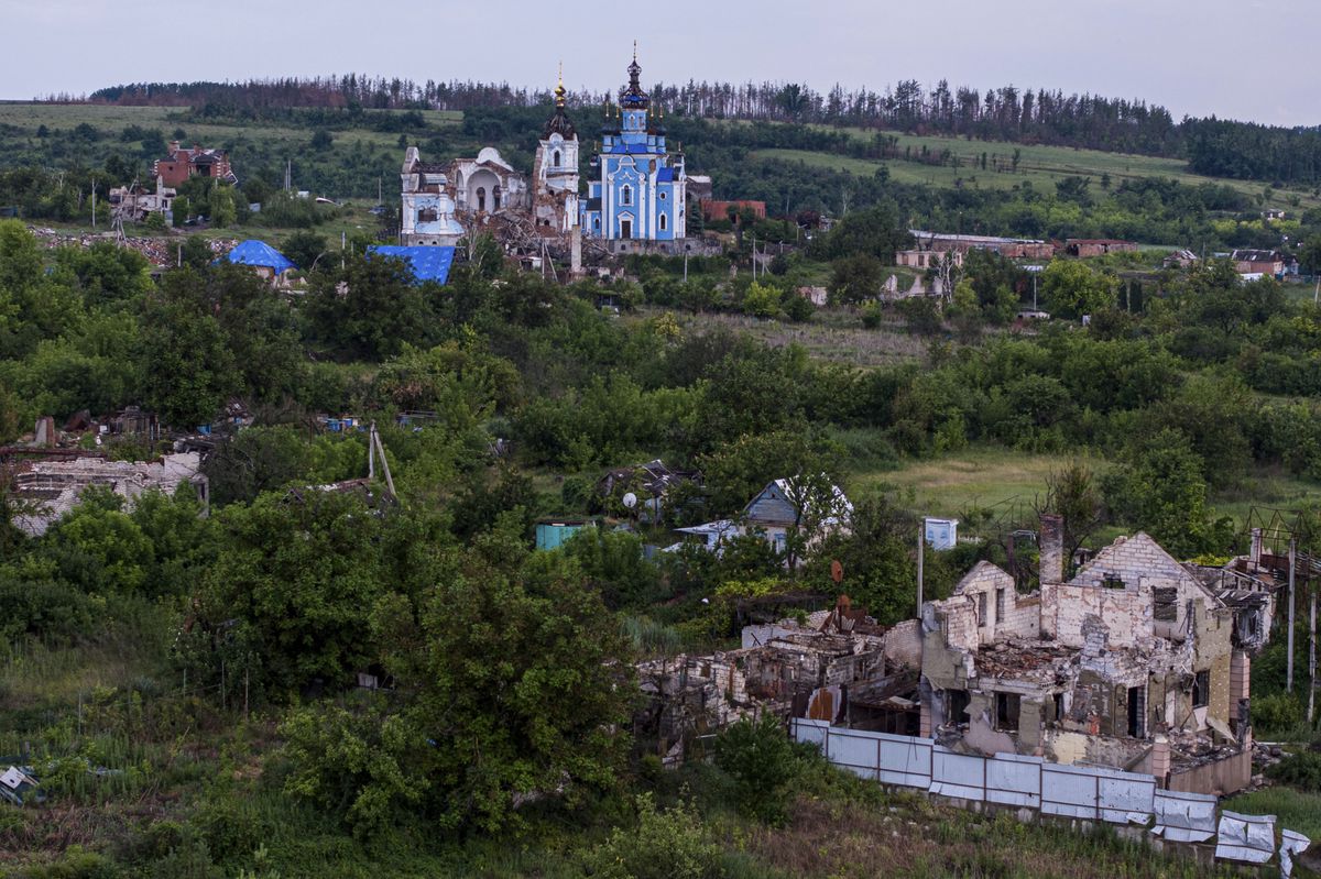 Houses destroyed by Russian forces are seen from above, in the liberated village of Bogorodychne, Ukraine, Monday, June 10, 2024. (AP Photo/Evgeniy Maloletka)