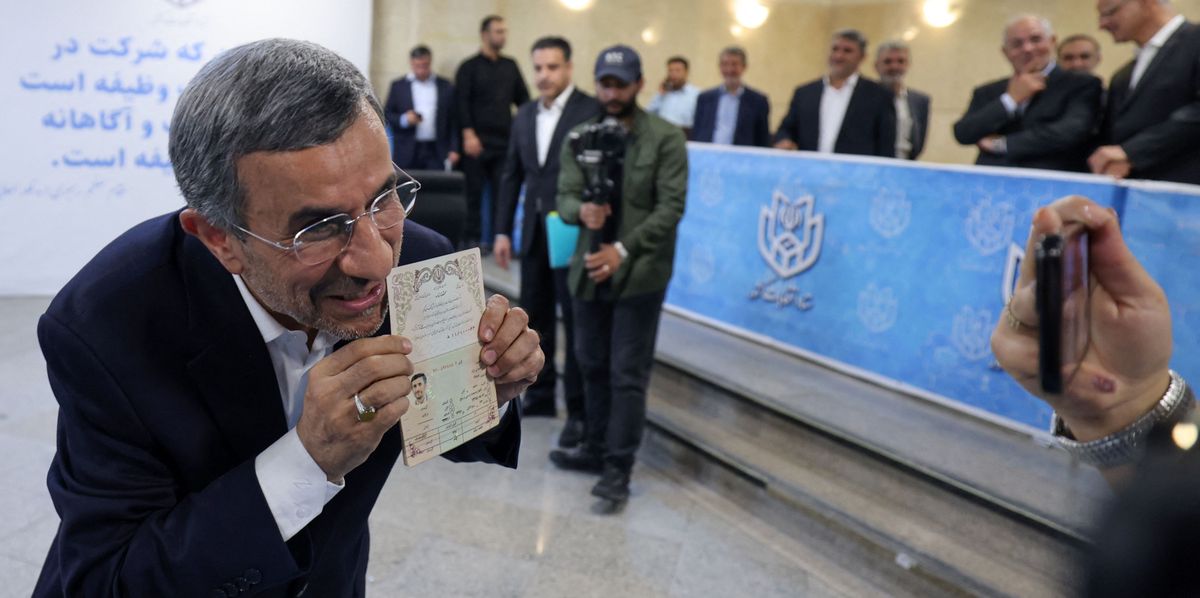 Former Iranian president Mahmoud Ahmadinejad poses for a picture after registering his candidacy for Iran's upcoming presidential election in Tehran on June 2, 2024. Iran's hardline former president, 67, held the post of president for two consecutive terms from 2005 to 2013 with his tenure marked by incendiary remarks on Israel and standoffs with the West especially over Iran's nuclear programme. Like all presidential hopefuls, his bid is pending the approval of the Guardian Council, a conservative-dominated 12-strong body of jurists that vets all candidates for public office. (Photo by ATTA KENARE / AFP)