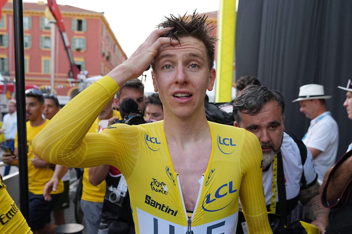 UAE Team Emirates team's Slovenian rider Tadej Pogacar wearing the overall leader's yellow jersey celebrates his overall victory after the 21st and final stage of the 111th edition of the Tour de France cycling race, a 33,7 km individual time-trial between Monaco and Nice, on July 21, 2024. (Photo by Laurent Cipriani / POOL / AFP)