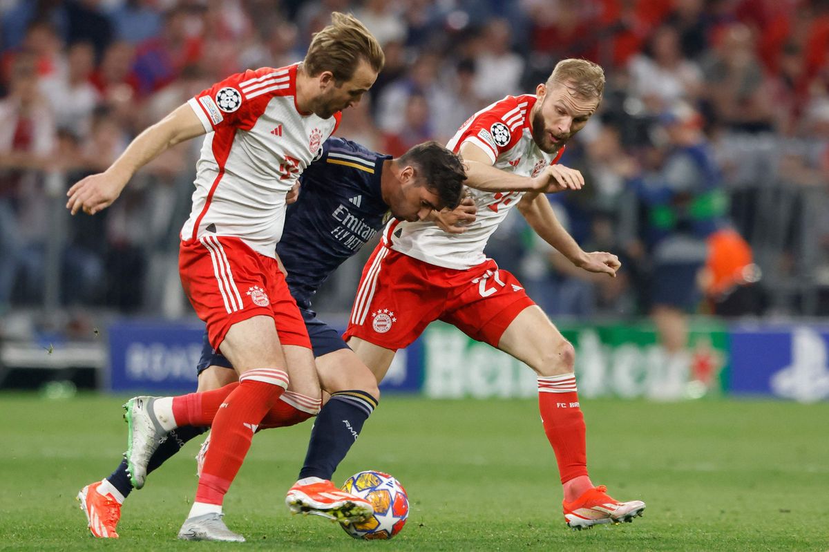 (L-R) Bayern Munich's English forward #09 Harry Kane, Real Madrid's Spanish forward #21 Brahim Diaz and Bayern Munich's Austrian midfielder #27 Konrad Laimer vie for the ball during the UEFA Champions League semi-final first leg football match between FC Bayern Munich and Real Madrid CF on April 30, 2024 in Munich, southern Germany. (Photo by Michaela STACHE / AFP)