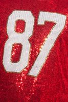 But maybe football? That’s not the case either — No. 87 is simply the jersey number of Swift’s friend and fellow football star Travis Kelce.