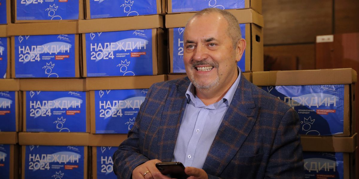 Boris Nadezhdin, a liberal Russian politician who is seeking to run in the March 17 presidential election, stands in front of boxes with subscription sheets with signatures gathered for him for the upcoming presidential election and brought for submitting to the Russia's Central Election Committee in Moscow, Russia, Wednesday, Jan. 31, 2024. Under Russian law, independent candidates must gather at least 100,000 signatures from 40 regions or more in order to get on the ballot. (AP Photo/Dmitry Serebryakov)