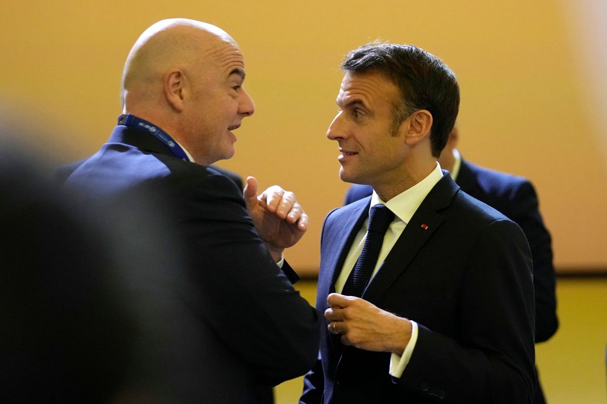 President of FIFA Gianni Infantino, left, speaks with France President Emmanuel Macron at the COP28 U.N. Climate Summit, Friday, Dec. 1, 2023, in Dubai, United Arab Emirates. (AP Photo/Rafiq Maqbool)