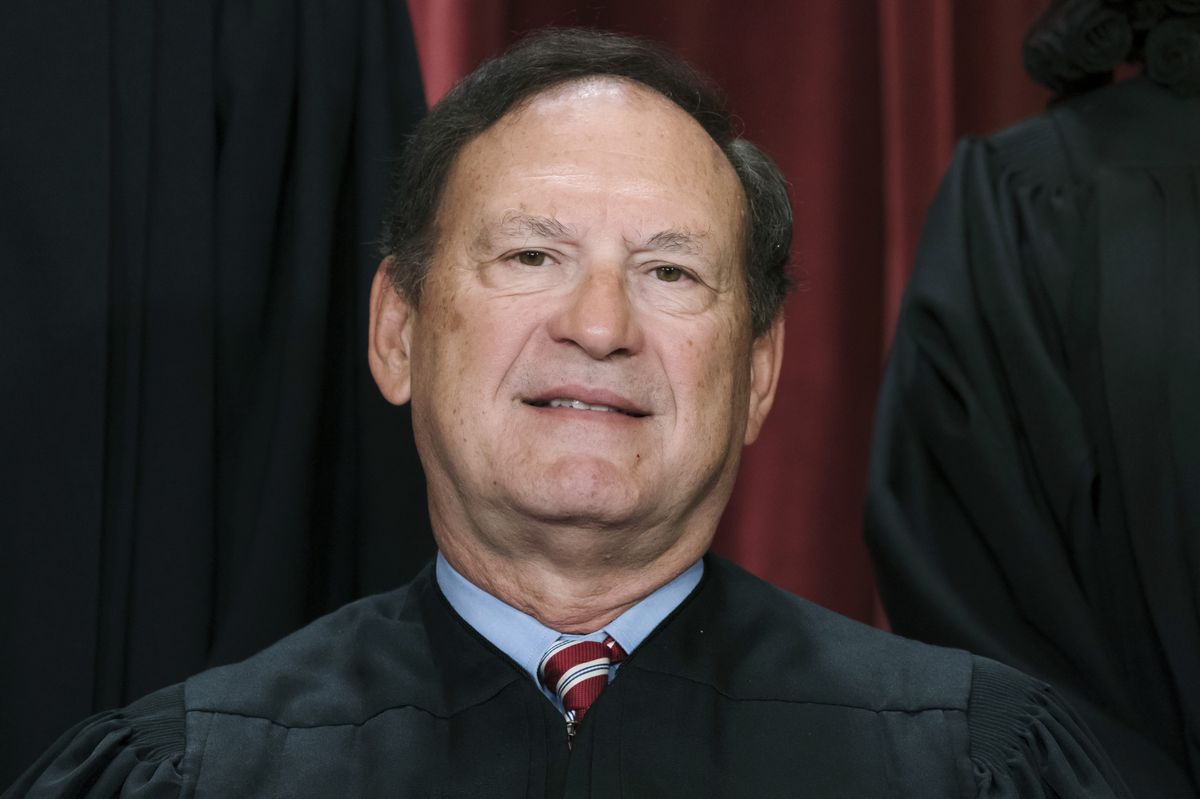 FILE - Associate Justice Samuel Alito joins other members of the Supreme Court as they pose for a new group portrait, Oct. 7, 2022, at the Supreme Court building in Washington. Alito rejects calls to step aside from Supreme Court cases on Trump and Jan. 6. (AP Photo/J. Scott Applewhite, File)
Samuel Alito