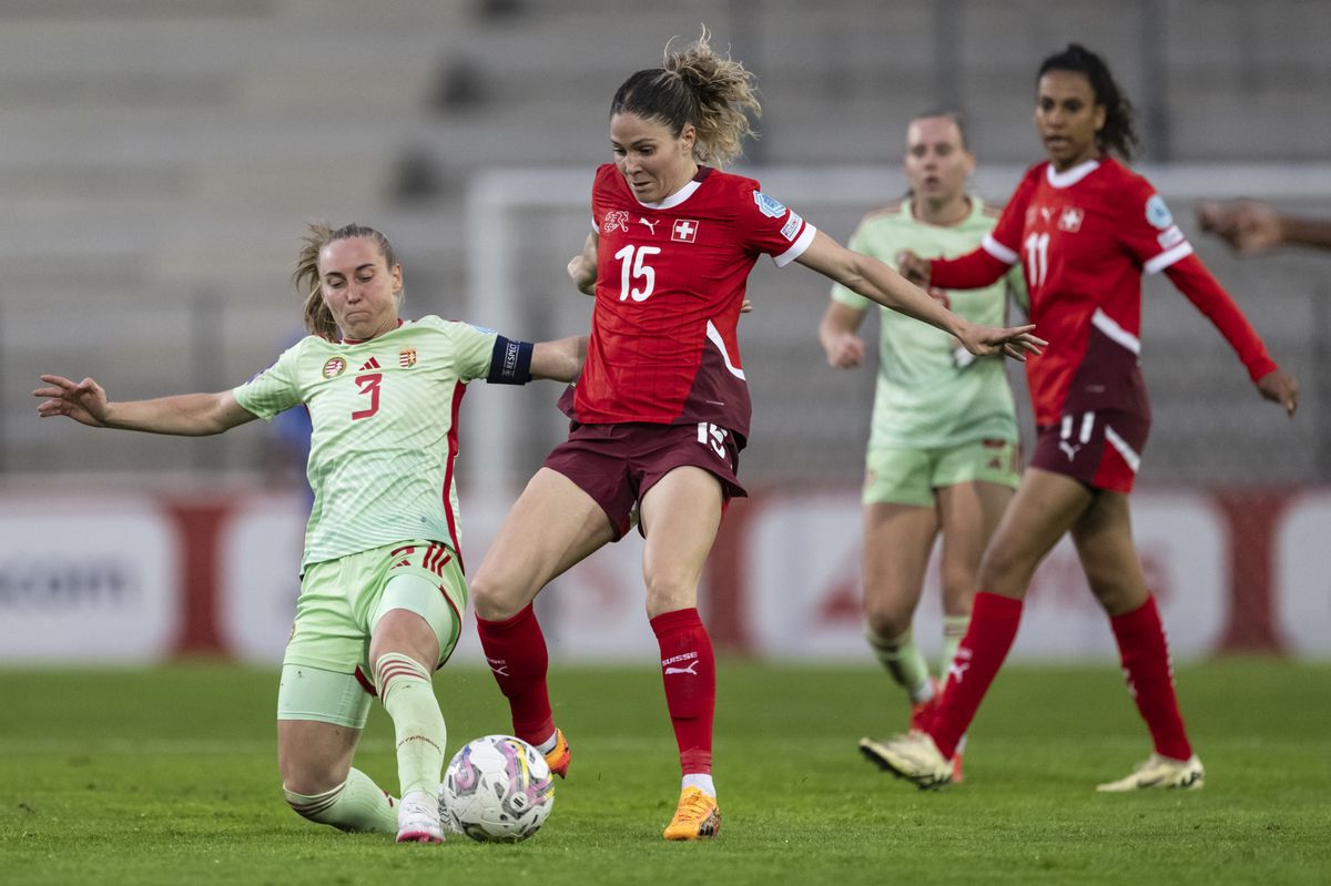 Hungary's Henrietta Csiszar, left, vies for the ball with Switzerland's Luana Buehler, during the Women's European Qualifier Group B1 match Switzerland against Hungary, on Friday, May 31, 2024 in Biel, Switzerland. (KEYSTONE/Alessandro della Valle)
