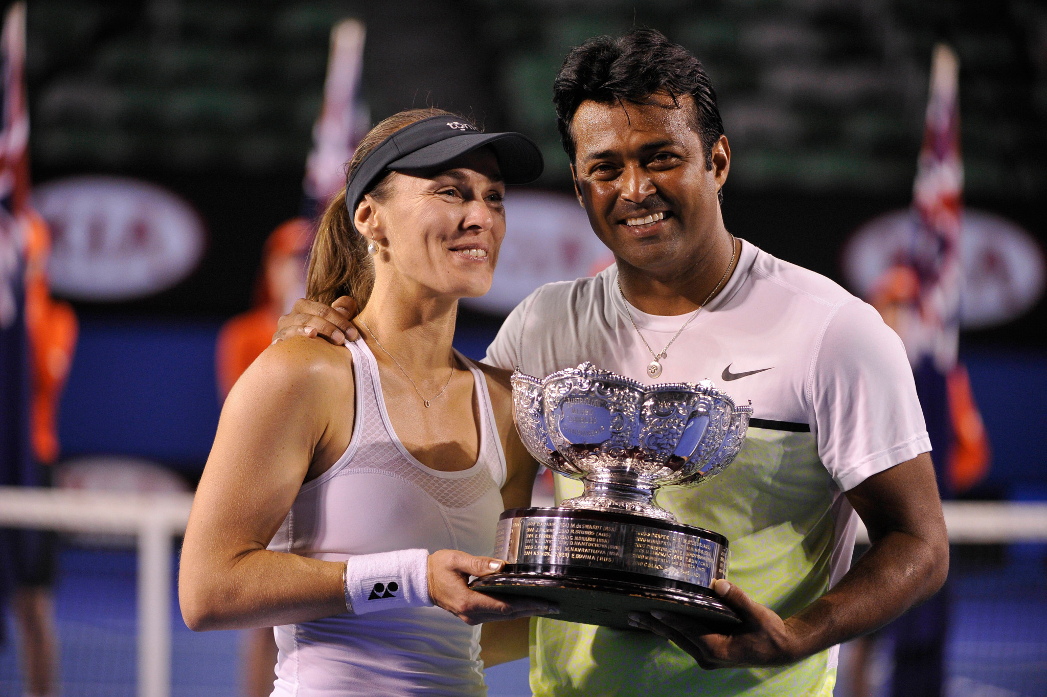 Martina Hingis and Leander Paes with the trophy after winning the mixed doubles final of the Australian Open 2015 in Melbourne.