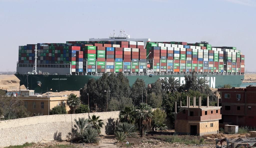 epa09104986 The container ship 'Ever Given' is moving in the Suez Canal, Egypt, 29 March 2021. The Suez Canal Authority on 29 March said that traffic is to resume after the large container ship 'Ever Given' was refloated. The Ever Given ran aground in the Suez Canal on 23 March, causing a huge traffic backlog of ships. EPA/KHALED ELFIQI