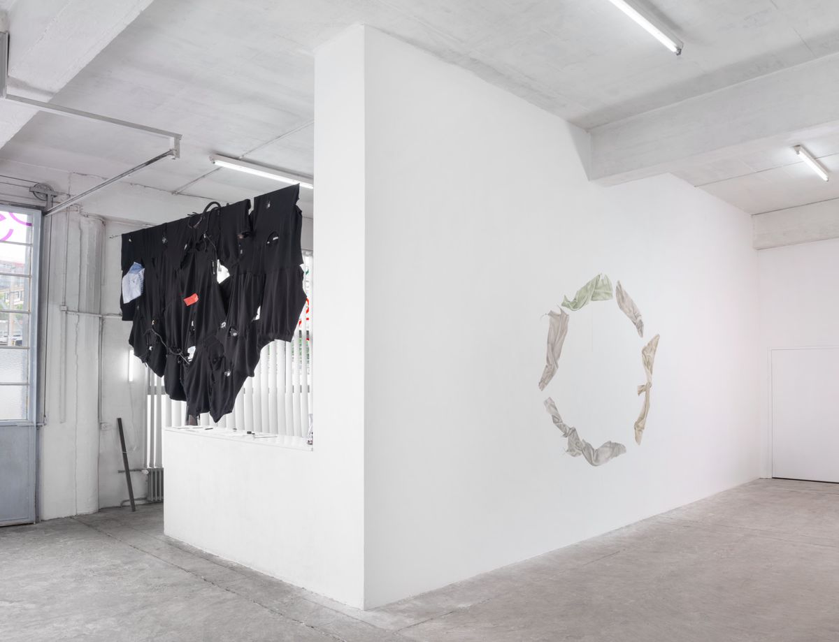 There is a stark contrast between an installation reminiscent of Sergio Marchionne (left) and a mural depicting a matriarchal civilization (right).