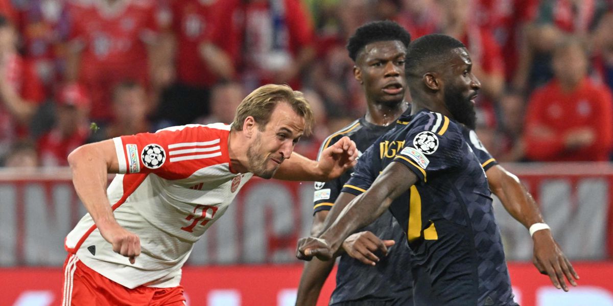 Bayern Munich's English forward #09 Harry Kane and Real Madrid's German defender #22 Antonio Rudiger vie for the ball during the UEFA Champions League semi-final first leg football match between FC Bayern Munich and Real Madrid CF on April 30, 2024 in Munich, southern Germany. (Photo by KERSTIN JOENSSON / AFP)