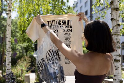 The coveted “Eras Tour” T-shirts can only be purchased on-site at the fan shop.