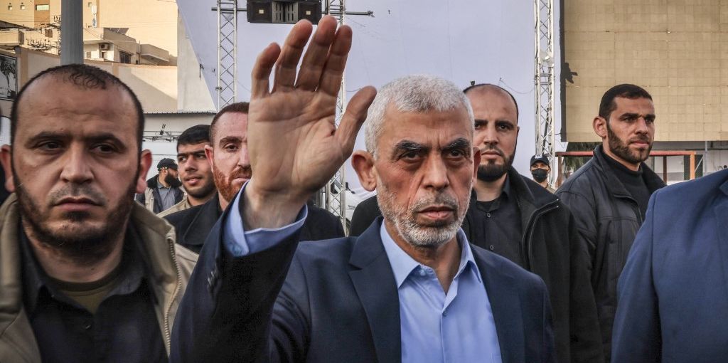 Yahia al-Sinwar (C), Gaza Strip chief of the Palestinian Islamist Hamas movement, waves to supporters as he arrives to attend a rally marking Al-Quds (Jerusalem) Day, a commemoration in support of the Palestinian people celebrated annually on the last Friday of the Muslim fasting month of Ramadan, in Gaza City, on April 14, 2023. (Photo by MOHAMMED ABED / AFP)