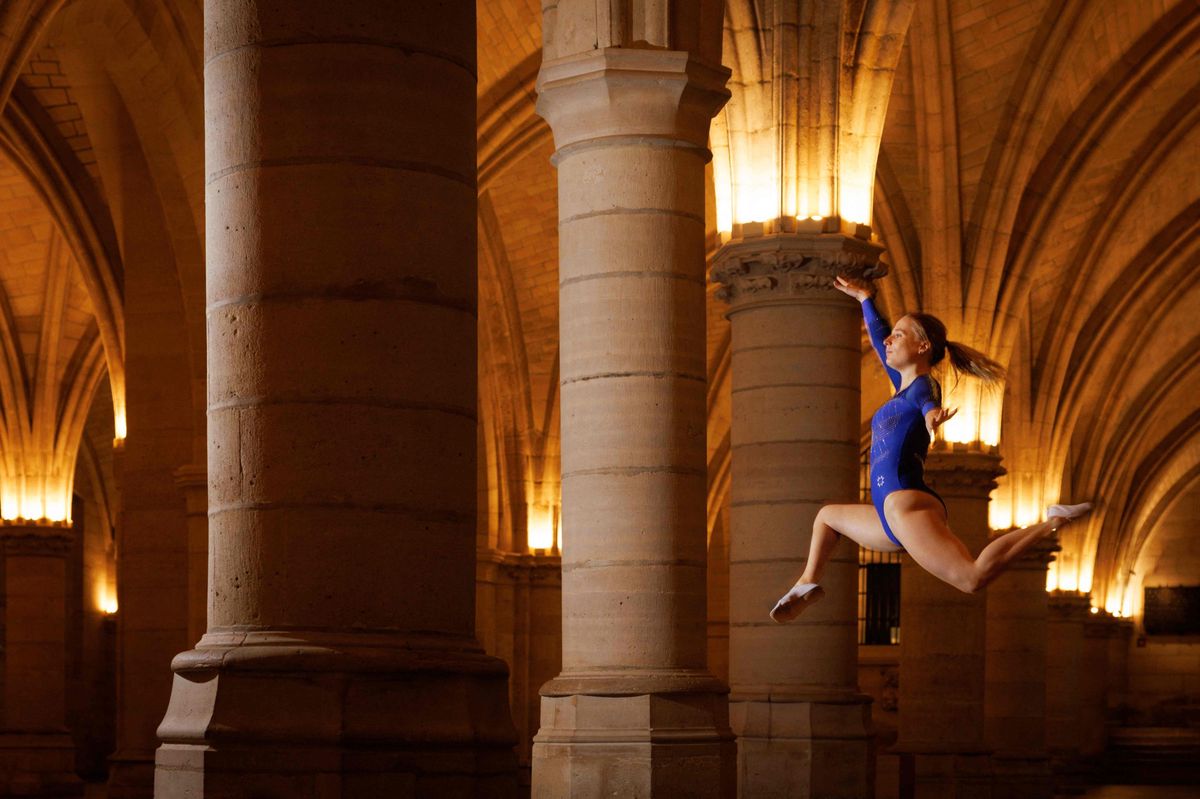 Leaping to freedom: Trampoline athlete Léa Labrousse flies over the Conciergerie, a former courthouse and prison.