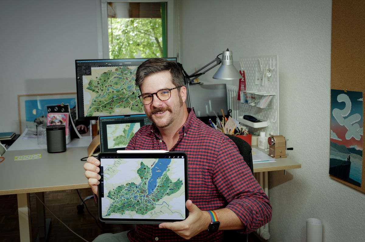 Genève, le 27 août 2024. Chez Lux Studio Rencontre avec Loris Grillet, jeune graphiste, qui est en train de finaliser une nouvelle carte du terroir genevois.
