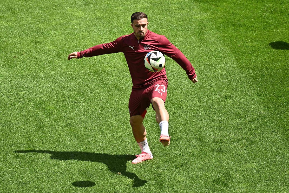 Switzerland's midfielder #23 Xherdan Shaqiri controls the ball during a warm-up session ahead of the UEFA Euro 2024 Group A football match between Hungary and Switzerland at the Cologne Stadium in Cologne on June 15, 2024. (Photo by JAVIER SORIANO / AFP)