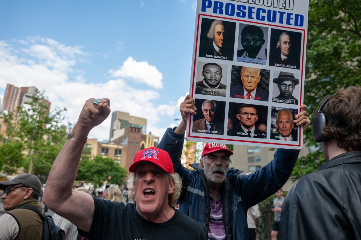 NEW YORK, NEW YORK - MAY 30: Supporters of former U.S. President Donald Trump react after he was found guilty in his hush-money trial at Manhattan Criminal Court on May 30, 2024 in New York City. Trump was found guilty on all 34 felony counts of falsifying business records in the first of his criminal cases to go to trial.   Spencer Platt/Getty Images/AFP (Photo by SPENCER PLATT / GETTY IMAGES NORTH AMERICA / Getty Images via AFP)