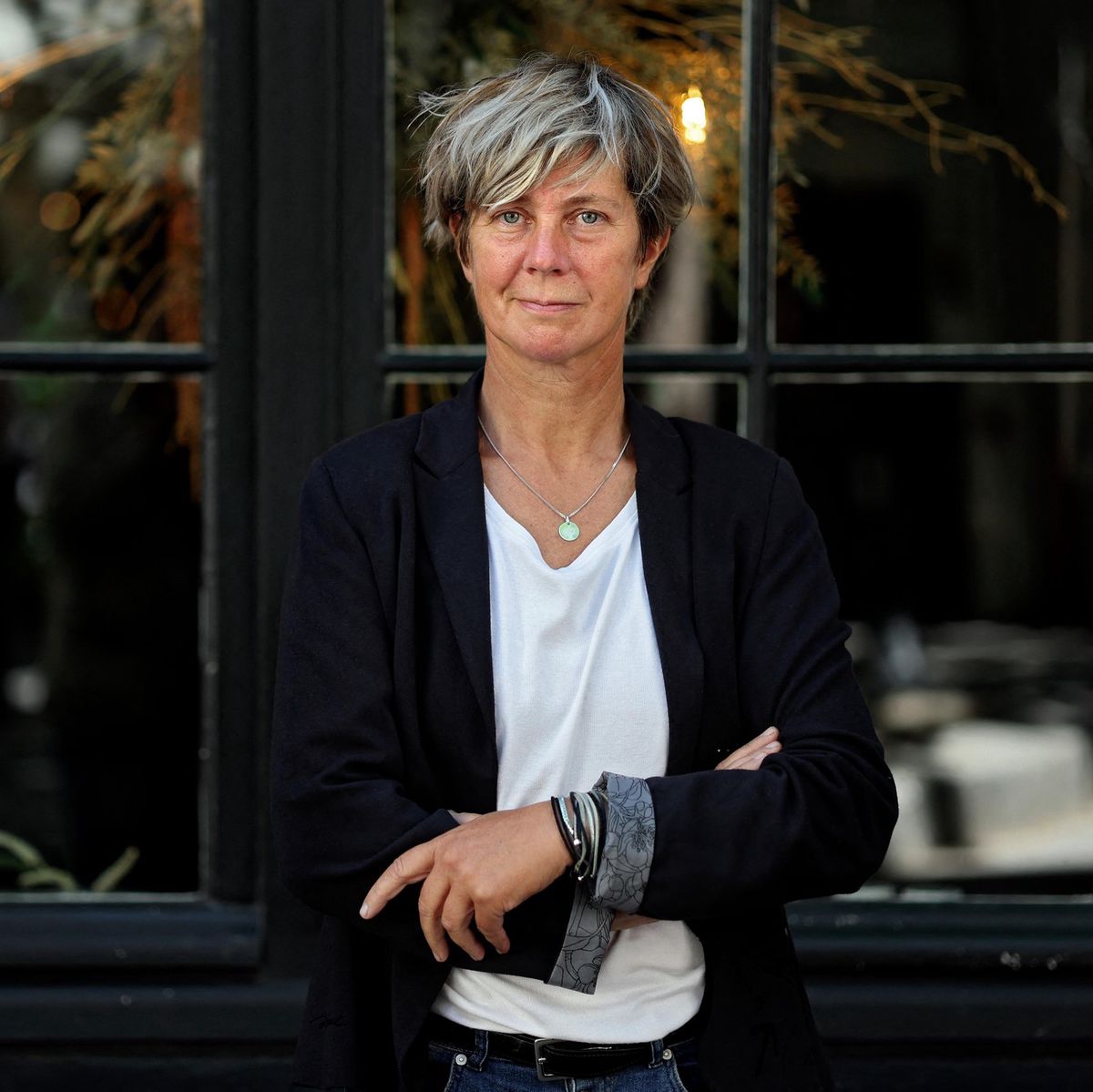 French writer Sandrine Collette poses in Paris on June 29, 2022. (Photo by THOMAS COEX / AFP)