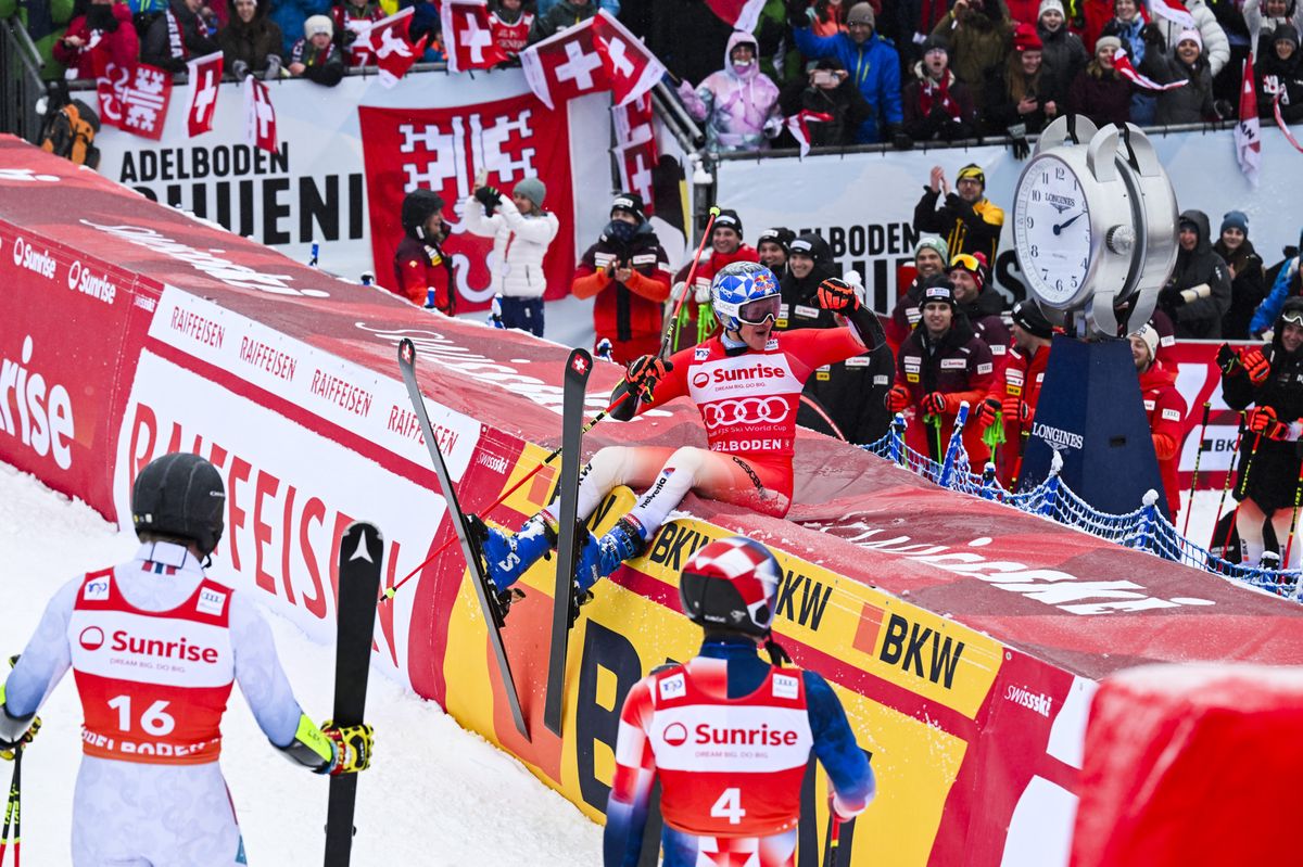 Second placed Aleksander Aamodt Kilde of Norway and third placed Filip Zubcic of Croatia watch Marco Odermatt of Switzerland celebrate after winning the second run of the men's giant slalom race at the Alpine Skiing FIS Ski World Cup in Adelboden, Switzerland, Saturday, January 6, 2024. (KEYSTONE/Anthony Anex)