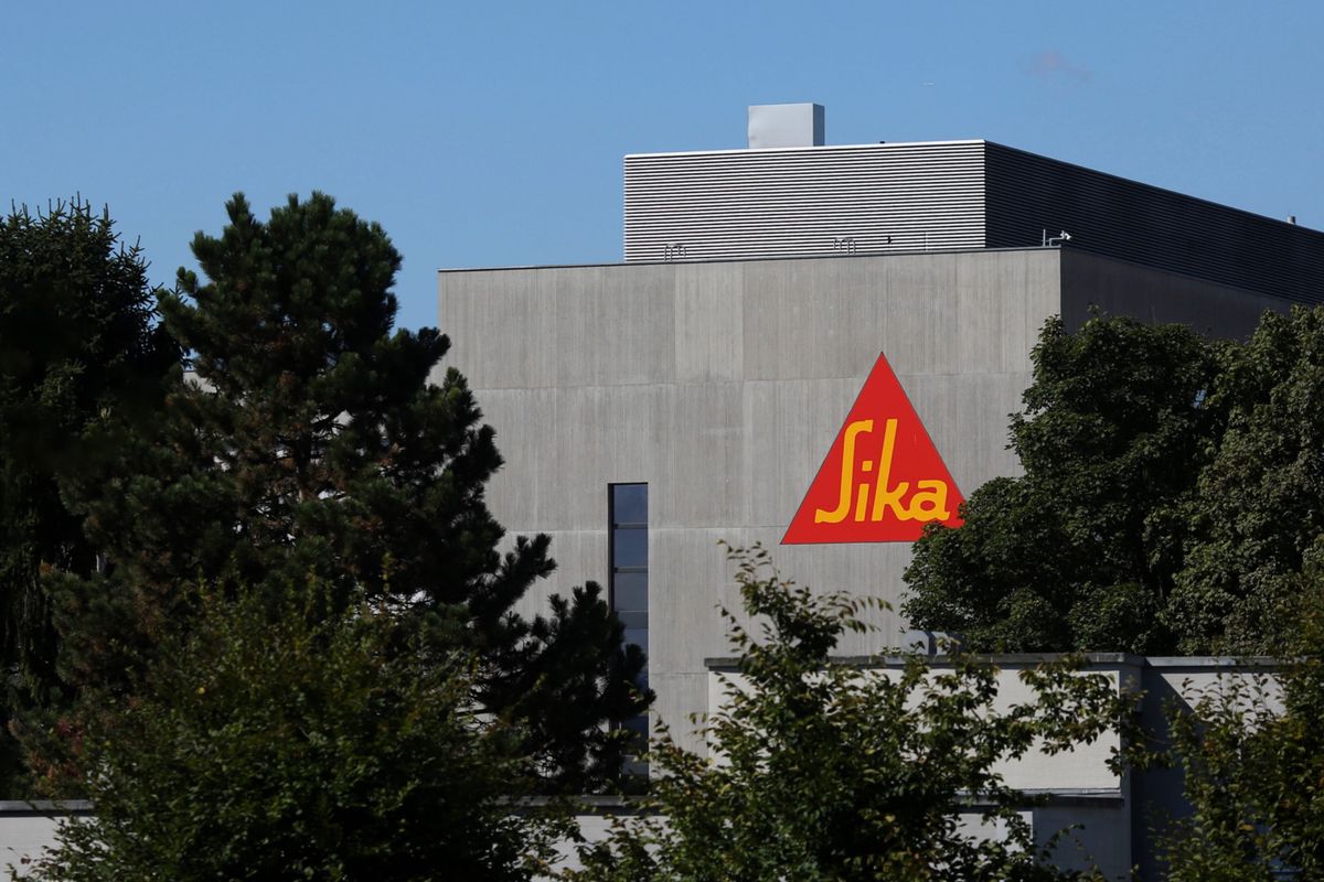 The Sika company logo sits on a wall outside a Sika AG adhesives manufacturing facility in Zurich, Switzerland, on Monday, Sept. 7, 2015. Sika's founding Burkard family remains committed to selling its $3 billion-stake in the adhesives maker against the company's will, saying it would be impossible to go back on the deal with Cie. de Saint-Gobain SA even if they wanted to. Photographer: Chris Ratcliffe/Bloomberg