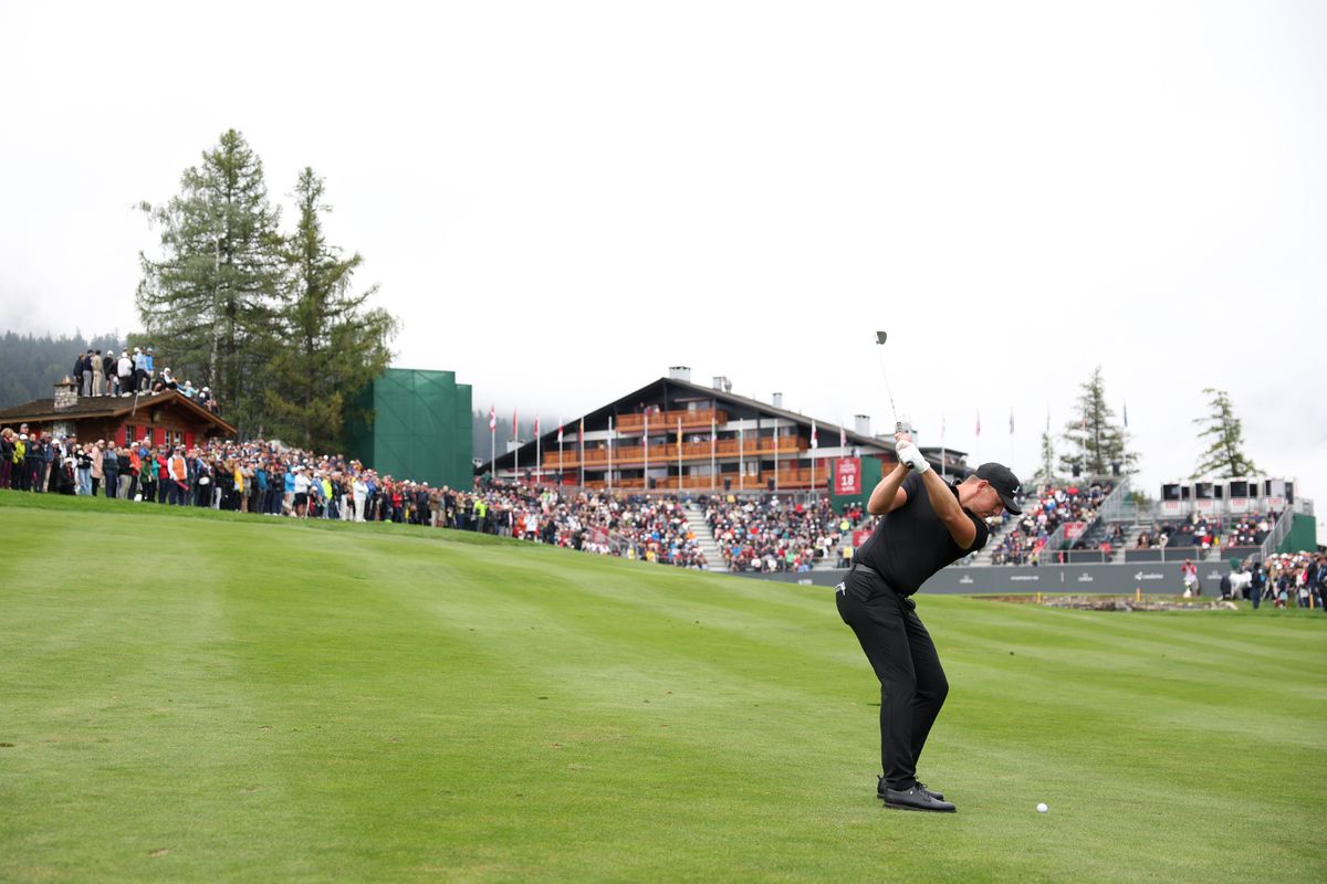 CRANS-MONTANA, SWITZERLAND - SEPTEMBER 08: Matt Wallace of England plays his second shot on the 18th hole on day four of the Omega European Masters 2024 at Crans-sur-Sierre Golf Club on September 08, 2024 in Crans-Montana, Switzerland. (Photo by Warren Little/Getty Images)