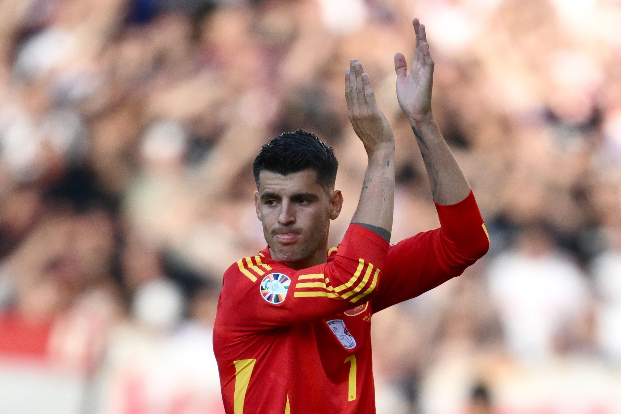 Spain's forward #07 Alvaro Morata applauds as he is substituted  during the UEFA Euro 2024 Group B football match between Spain and Croatia at the Olympiastadion in Berlin on June 15, 2024. (Photo by Christophe SIMON / AFP)