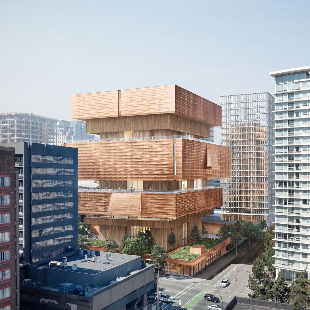 Hochmodernes Gebäude mit übereinander gestapelten Würfeln in urbaner Umgebung.