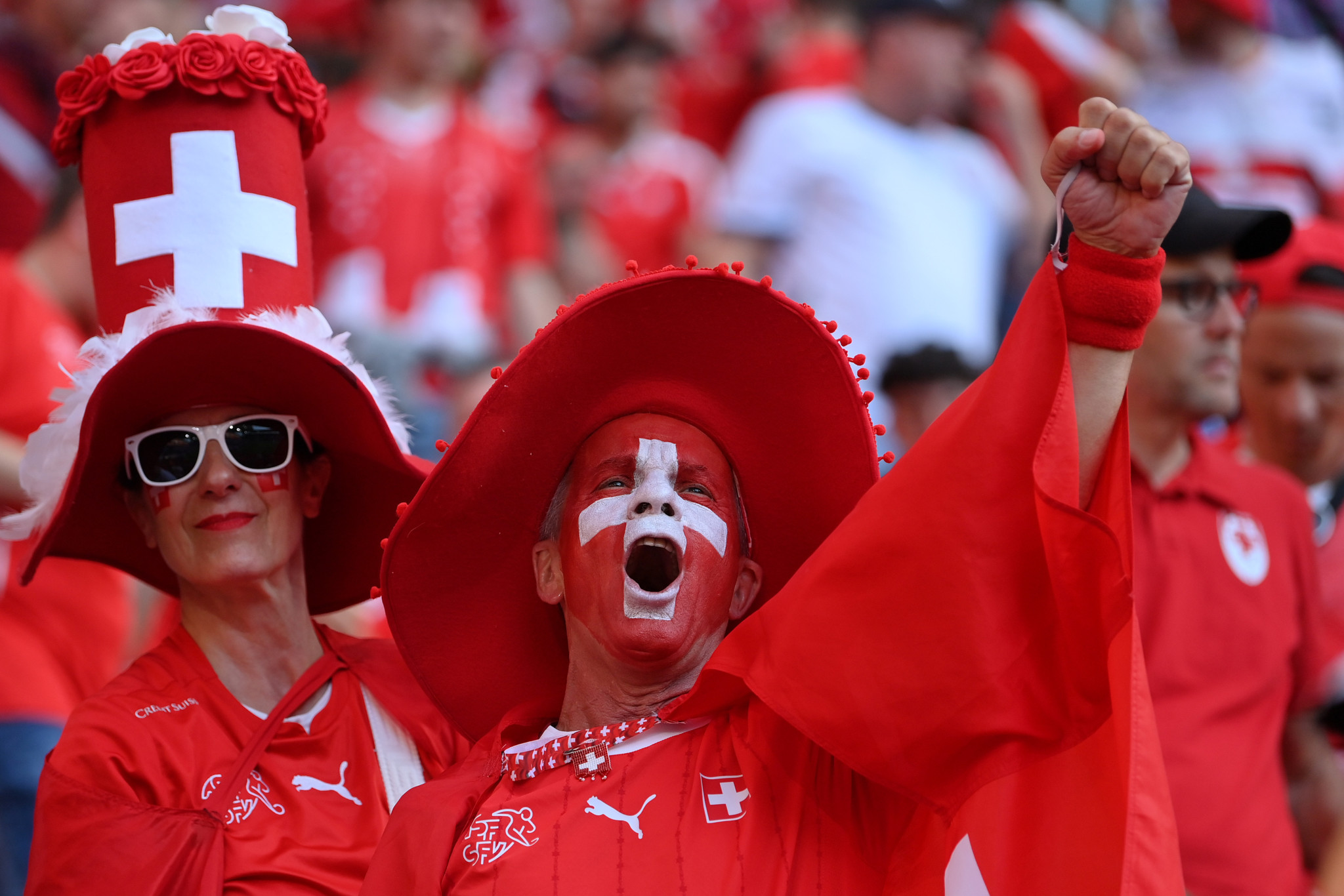 COLOGNE, GERMANY - JUNE 19: Switzerland fans celebrate during the UEFA EURO 2024 group stage match between Scotland and Switzerland at Cologne Stadium on June 19, 2024 in Cologne, Germany. (Photo by Justin Setterfield/Getty Images)