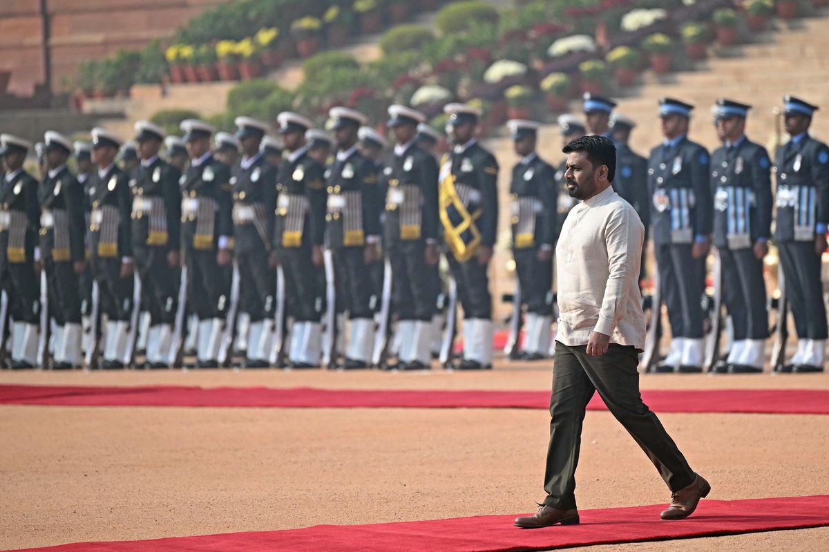 Sri Lanka's President Anura Kumara Dissanayake inspects a guard of honour during his ceremonial reception at the presidential palace Rashtrapati Bhavan in New Delhi on December 16, 2024. Dissanayake was in India on December 16 for his first overseas visit as head of state, vowing to bolster ties between the neighbours. (Photo by Sajjad HUSSAIN / AFP)