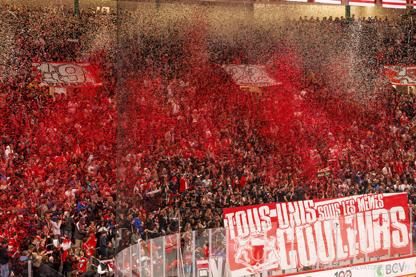 Lausanne's supporters launch confetti, during the fifth leg of the National League regular season game of the Swiss Championship between Lausanne HC, LHC, and HC Davos, HCD, at the Vaudoise Arena in Lausanne, Switzerland, Monday, March 25, 2024. (KEYSTONE/Salvatore Di Nolfi)