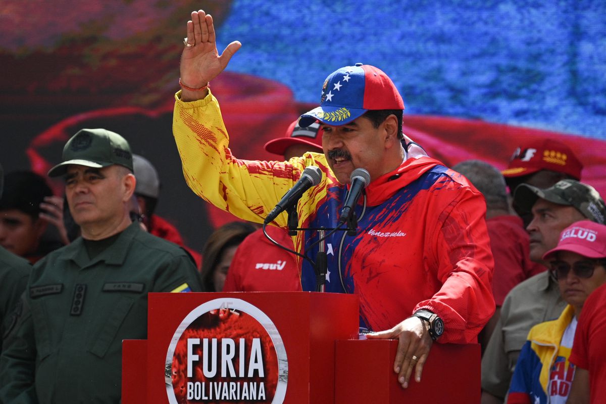 (FILES) Venezuelan President Nicolas Maduro speaks to supporters during a rally to commemorate 20 years of the anti-imperialist declaration of the late former President Hugo Chavez in Caracas on February 29, 2024. German broadcaster Deutsche Welle said on March 5, 2024, it had been taken off the air in Venezuela, a day after President Nicolas Maduro described it as a "nazi" outlet after it ran a report on corruption in the country. Maduro on Monday accused Deutsche Welle, which publishes in multiple languages, of running a media "campaign" against Venezuela after the publication of a video about the links between politicians and organized crime in Latin America. (Photo by Federico PARRA / AFP)