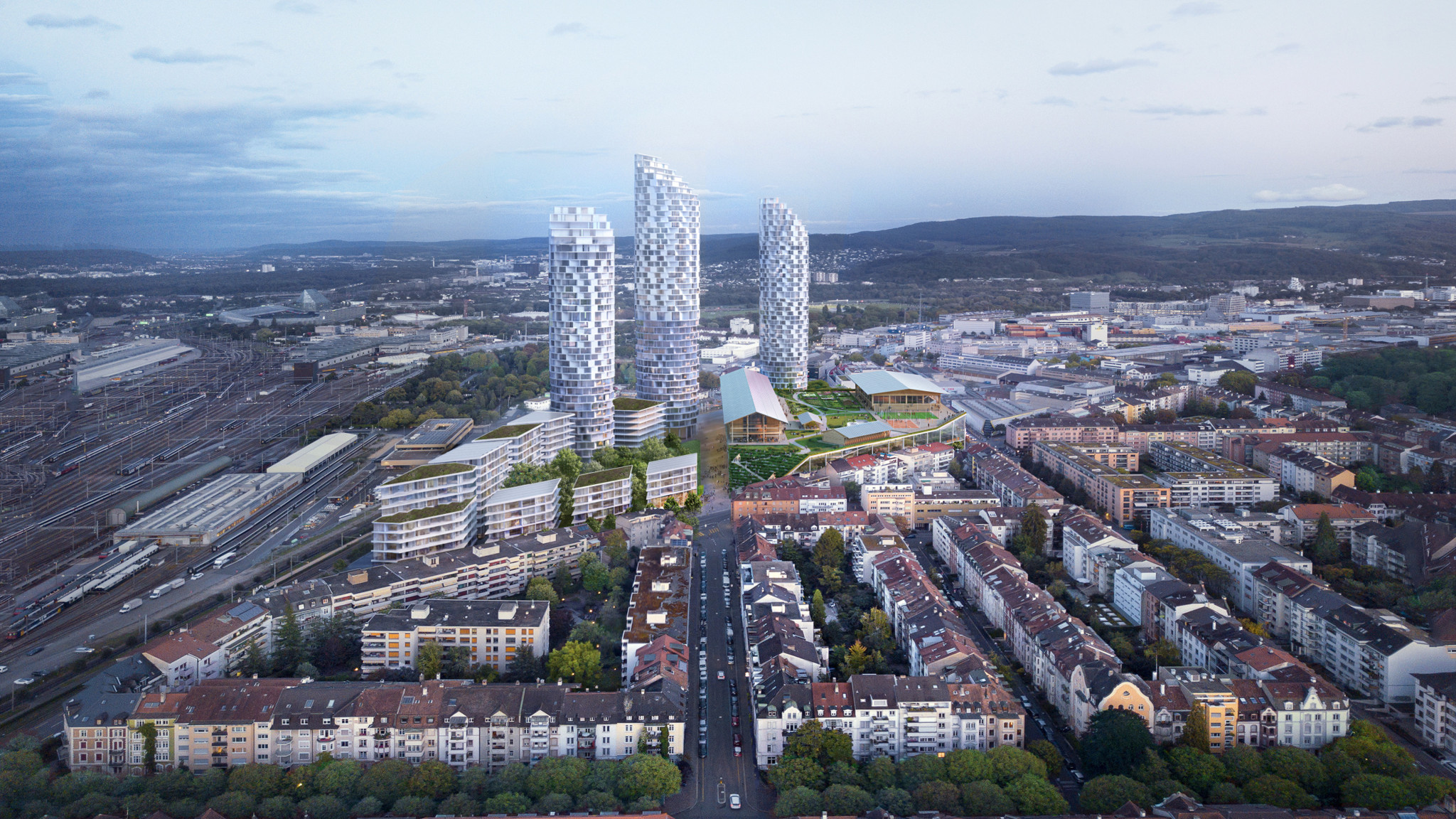 Luftaufnahme einer Stadtlandschaft mit drei modernen Hochhäusern und einem Gebäude mit begrüntem Dach inmitten einer dichten Wohnbebauung. Luftaufnahme einer Stadtlandschaft mit drei modernen Hochhäusern und einem Gebäude mit begrüntem Dach inmitten einer dichten Wohnbebauung.