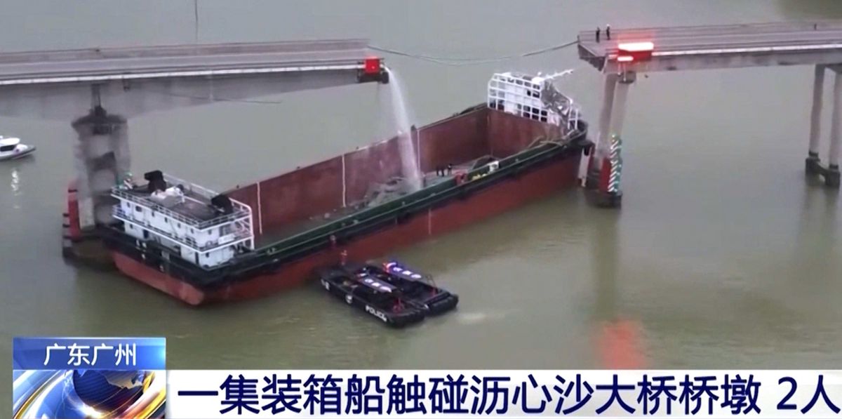 In this image from video released by China's CCTV, people inspect the broken Lixinsha Bridge after being hit by a container ship in Nansha District of Guangzhou, south China's Guangdong Province, Thursday, Feb. 22, 2024. Few people are dead and missing after a massive container ship crashed into the bridge south of the city of Guangzhou in southern China early Thursday, causing a section of the bridge to come crashing down along with vehicles. (CCTV via AP Video)