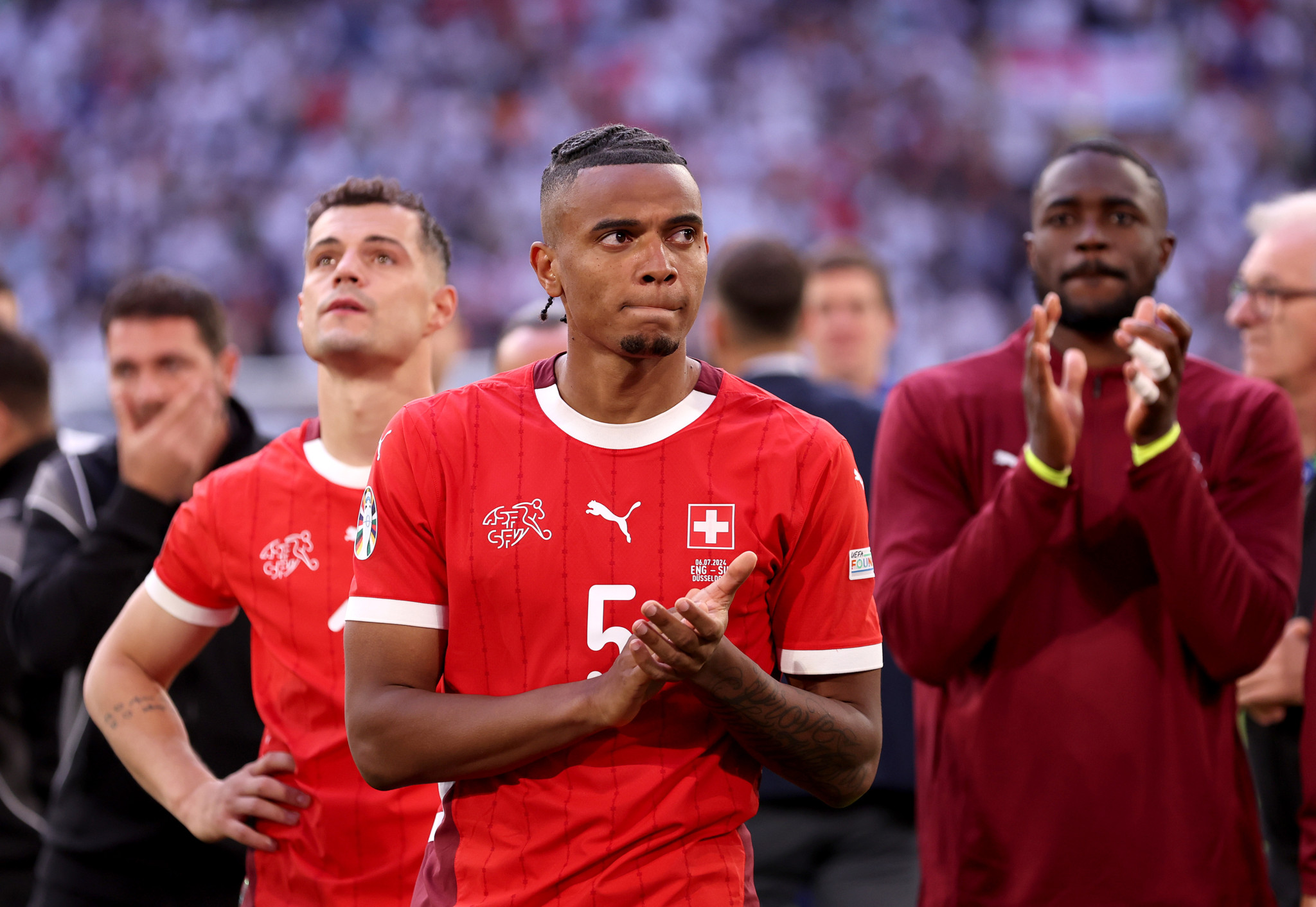 DUSSELDORF, GERMANY - JULY 06: Manuel Akanji of Switzerland acknowledges the fans after defeat in the penalty shoot out during the UEFA EURO 2024 quarter-final match between England and Switzerland at Düsseldorf Arena on July 06, 2024 in Dusseldorf, Germany. (Photo by Carl Recine/Getty Images)